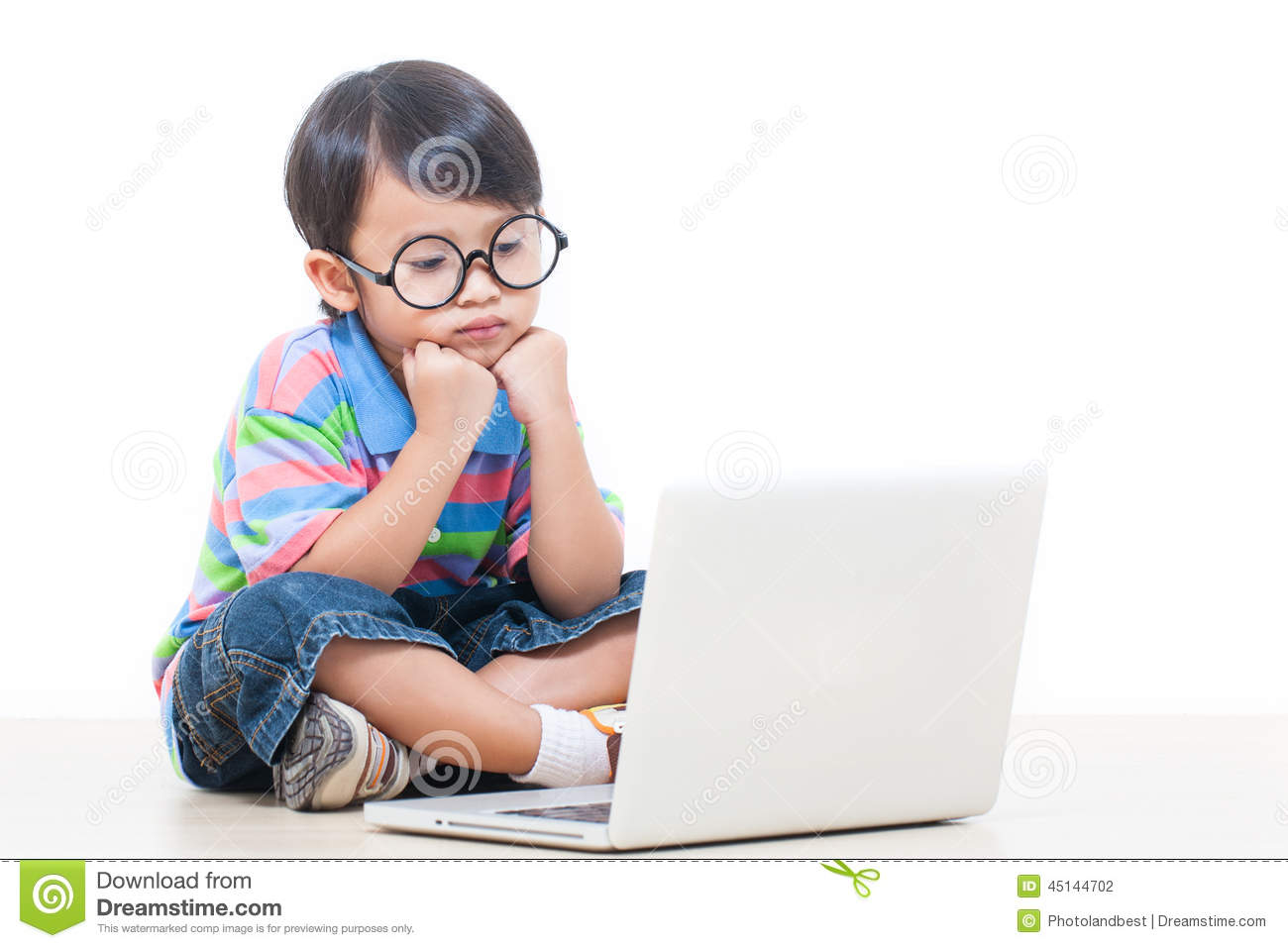 A Cute Boy Using a Computer