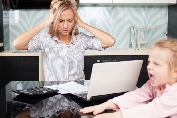 Shutterstock Woman with Child at Work