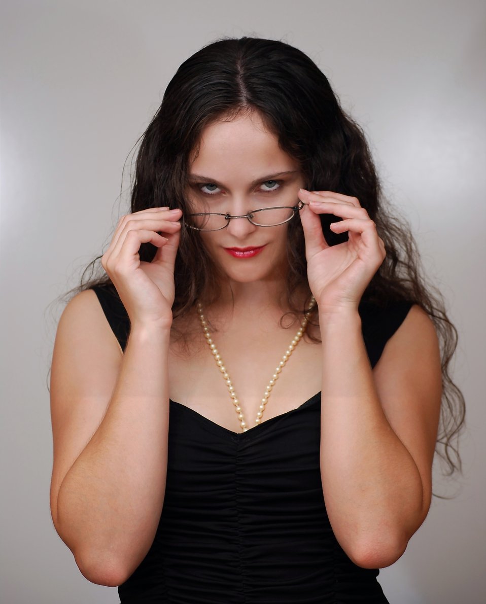 Woman Looking Over Her Glasses