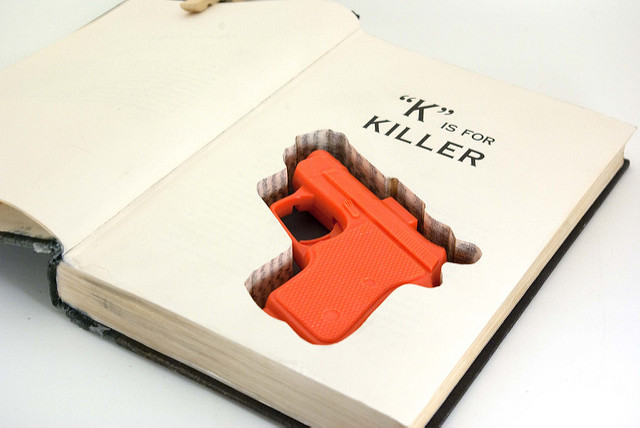 Gun in Hollowed Out Book