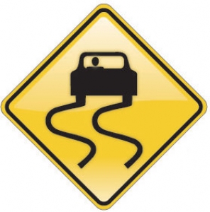 Slippery When Wet Road Sign