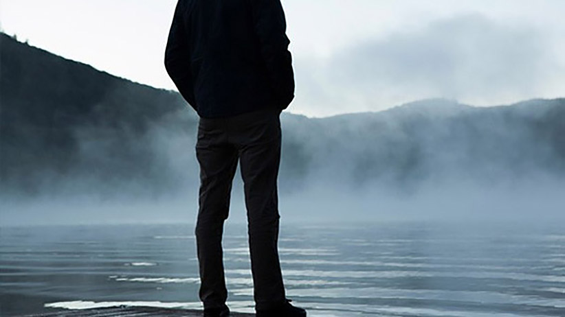 Person Standing Alone at Lake