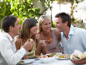 People Eating Dinner at Restaurant