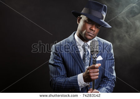 Image of a Black Man Singing with a Hat