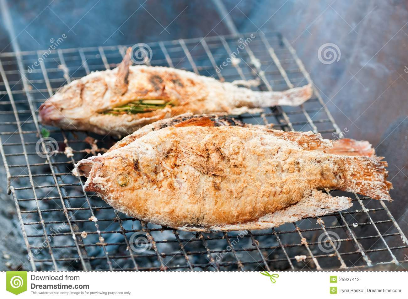 Grilling Fish On Campfire