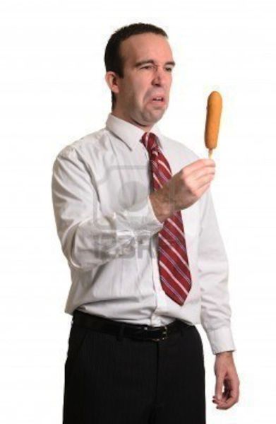 Guy Looking at Corn Dog