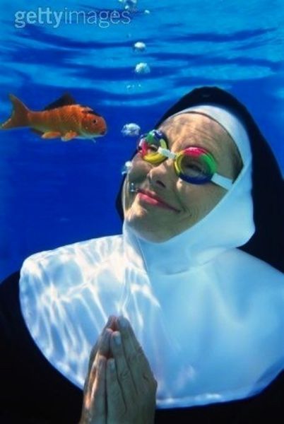 Nun Underwater with Fish