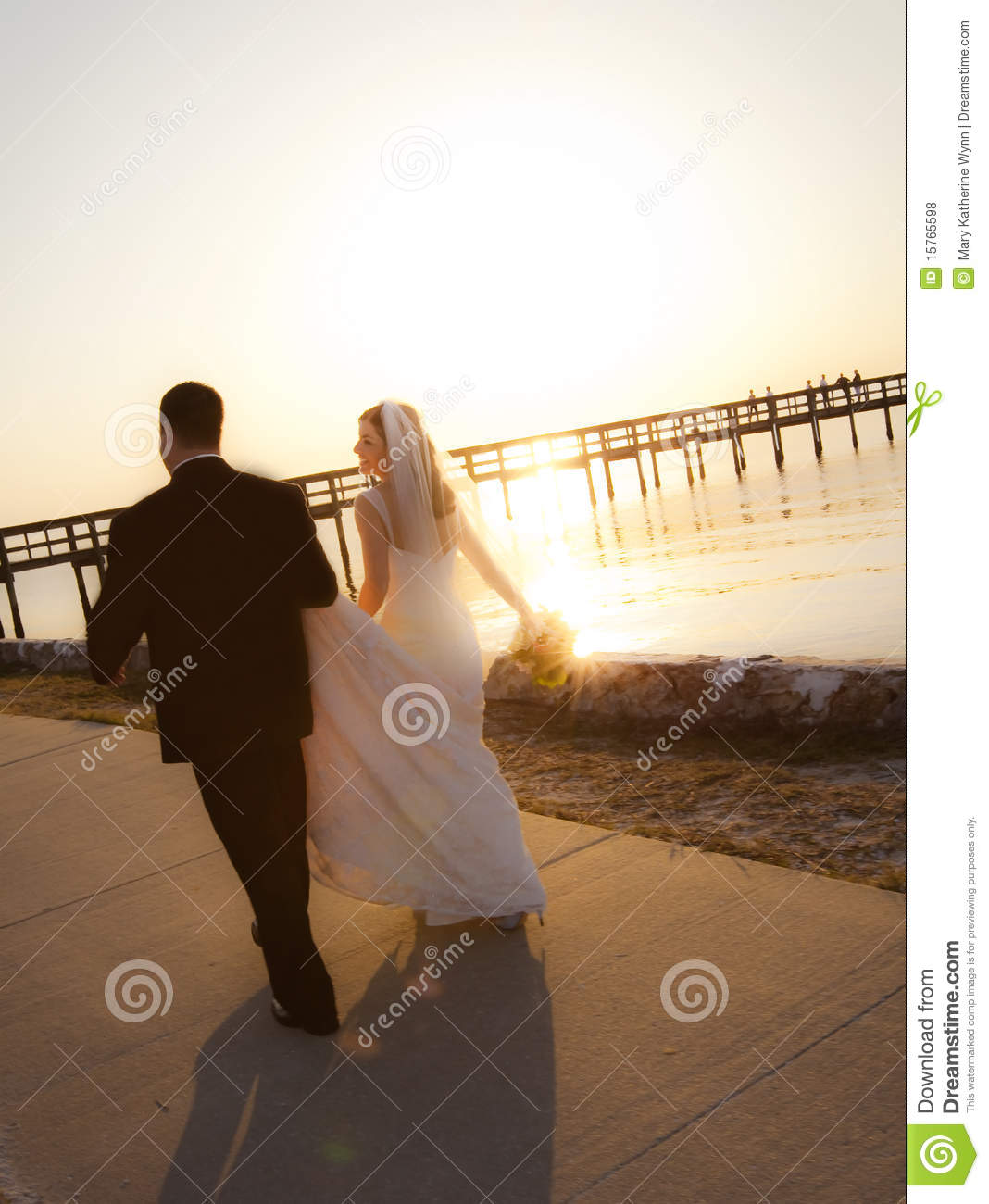 Wedding Couple Walking into Sunset