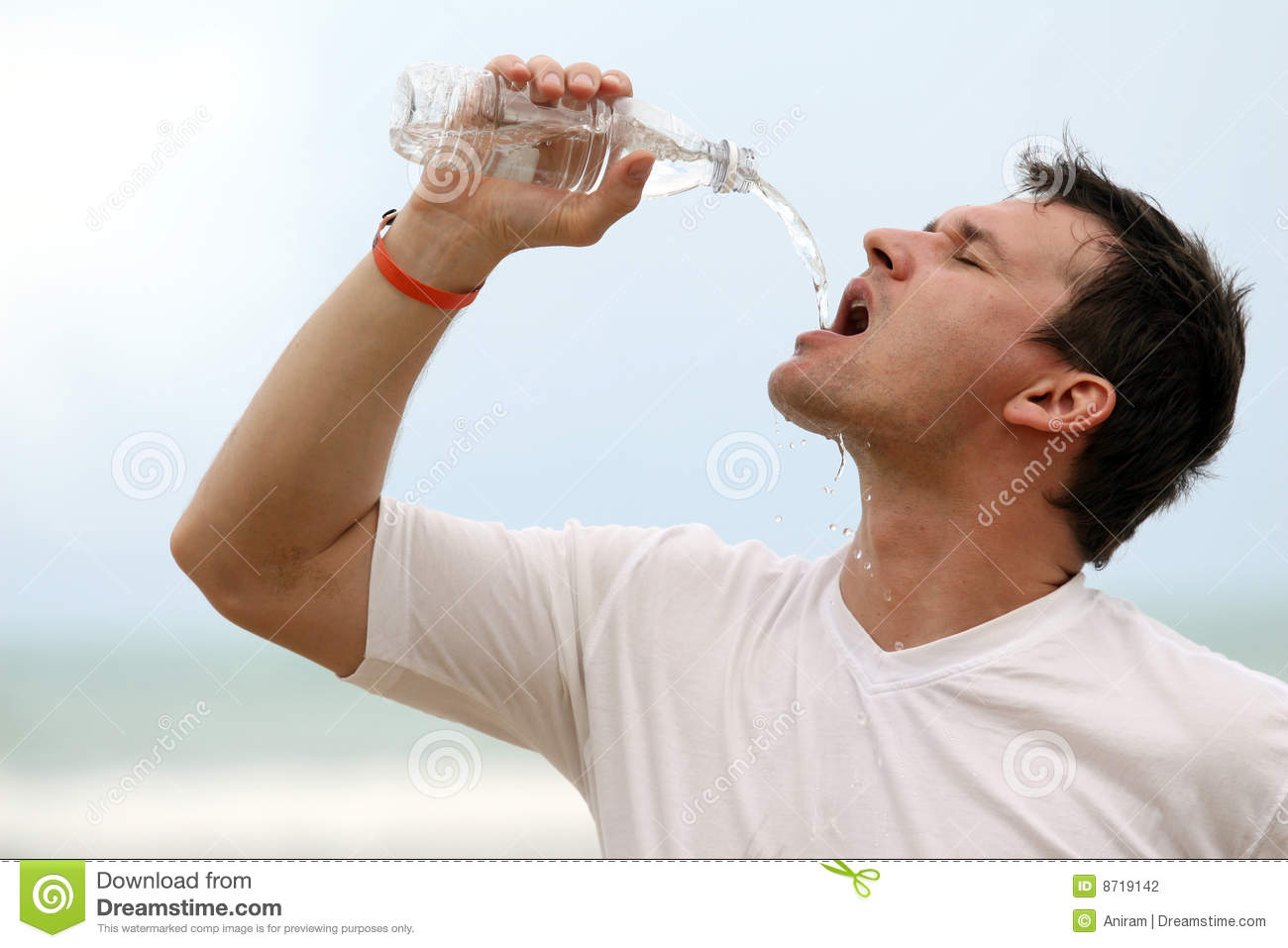 Man Drinking From Water Bottle