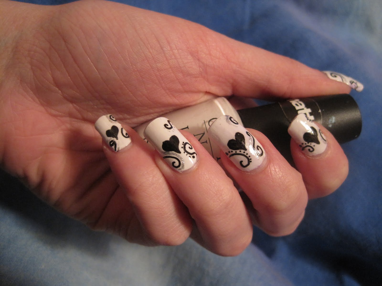 Black Nails with Heart Design Black Nails with Heart Design
