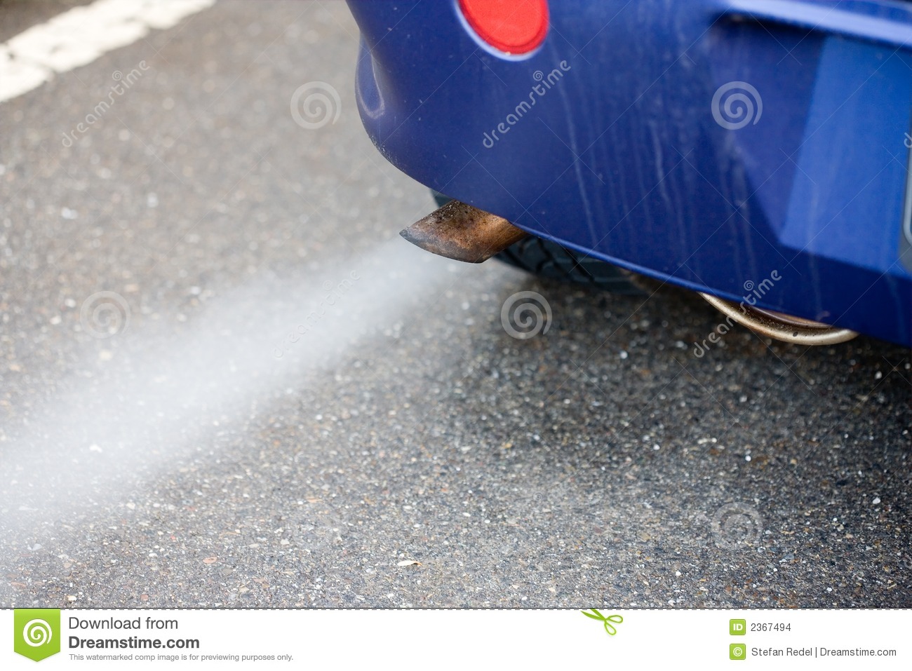 Car Blowing Blue Smoke From Exhaust