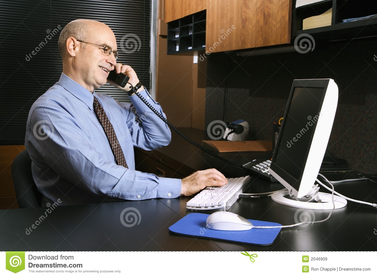 Businessman On Phone at Desk