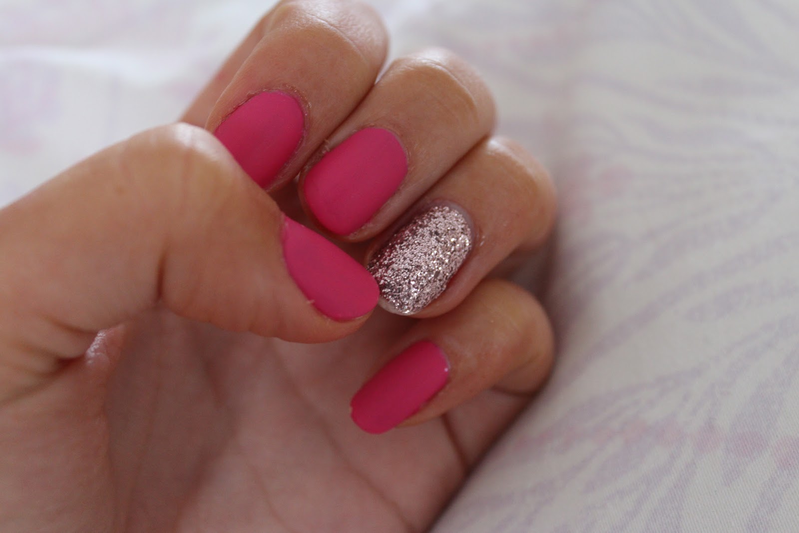 Pink Nails with Glitter Ring Finger