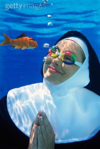 Nun Underwater with Fish