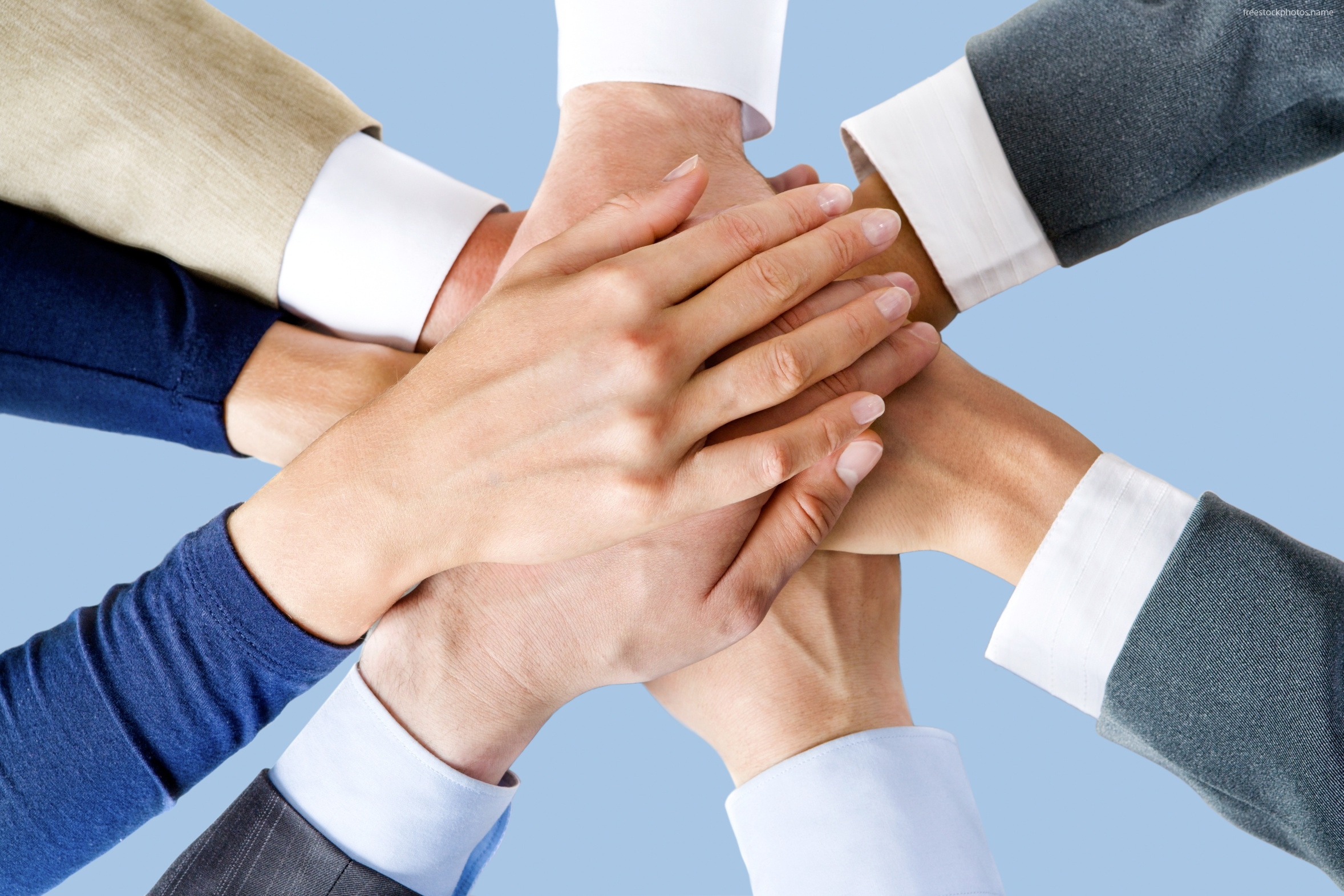 Business People Hands On Top of Hands