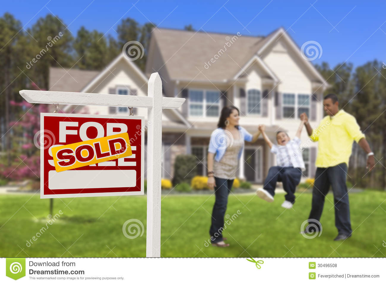 Family in Front of House with Sold Sign